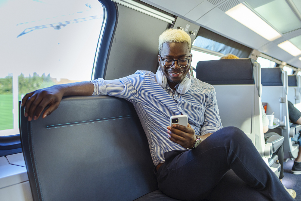 Professional completing a longitudinal assessment on a mobile device to support continuous learning and certification maintenance.
